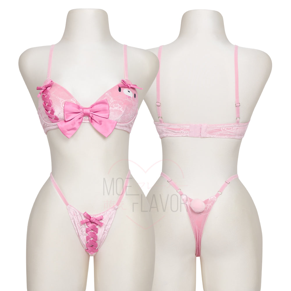 Pastel Winter Bikini Pink by MOEFLAVOR and Gloomy Bear. Bikini with embroidered Gloomy Bear face, lace-up side with bow, center bow on top, adjustable hook-and-eye closure, and matching bottoms with puffy tail.