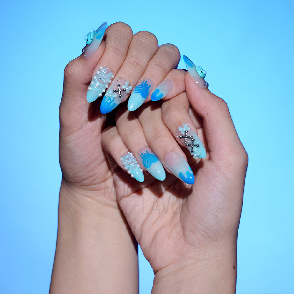 Blue press-on nails by MOEFLAVOR, handmade by Clawstrike, inspired by the Gloomy Bear collection. Bold nails with an edgy, heavenly touch to complete style.