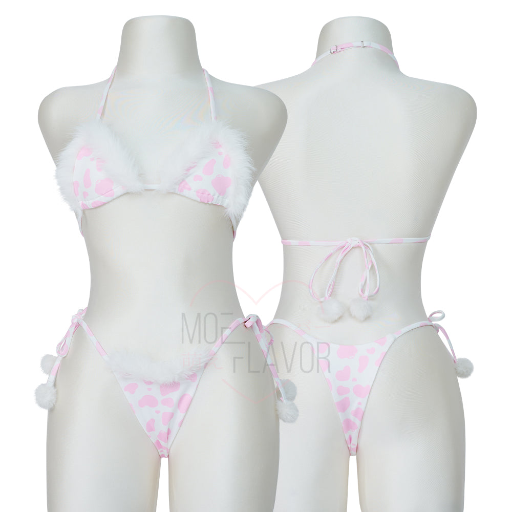 Kawaii Anime Plush Winter Cow Bikini by MOEFLAVOR, featuring a baby pink triangle top and pastel cow print bottoms with faux fur trim and playful pom poms. Stretchy and adjustable for a perfect fit.